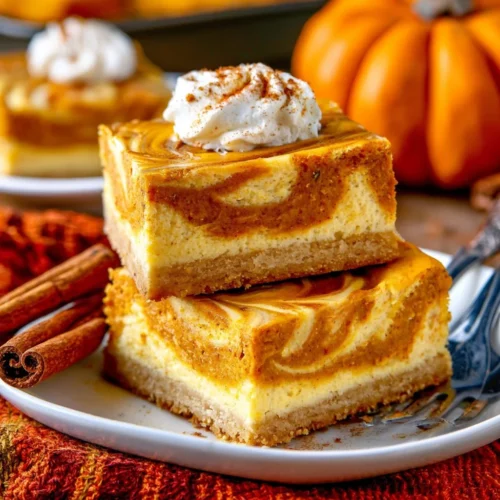 Delicious easy pumpkin cheesecake bars served on a plate