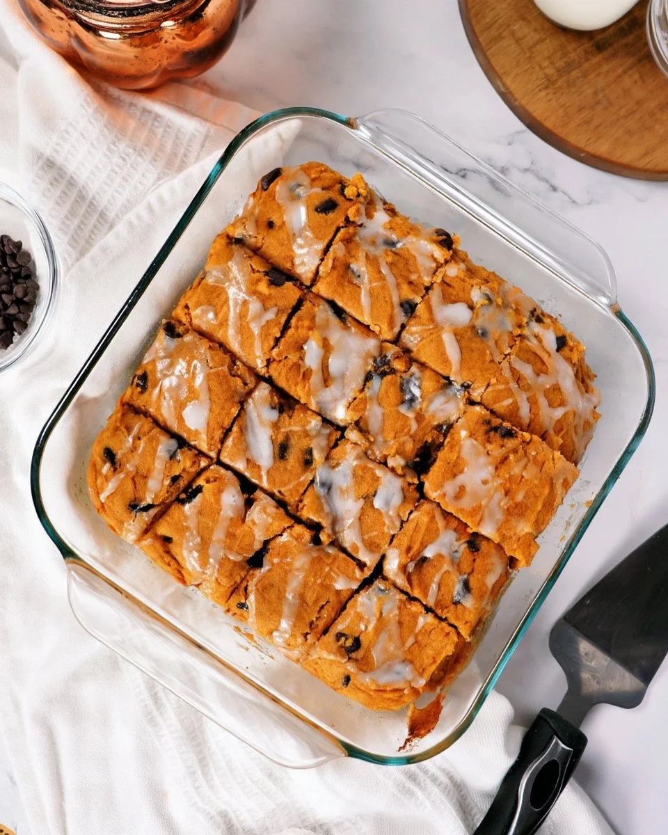 Delicious pumpkin chocolate chip cookie bars with chocolate chips on top.